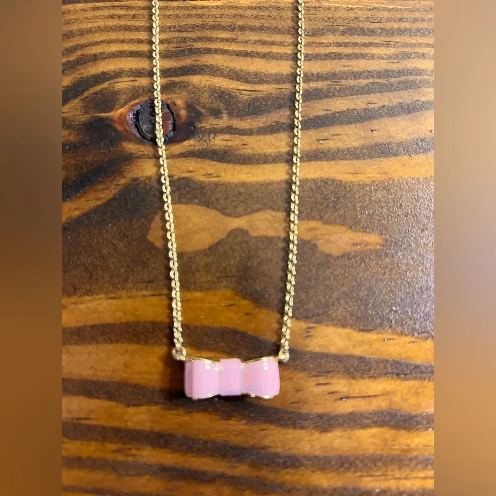 Kate Spade Pink and Gold Bow Necklace gold tone with pink enamel bow feminine